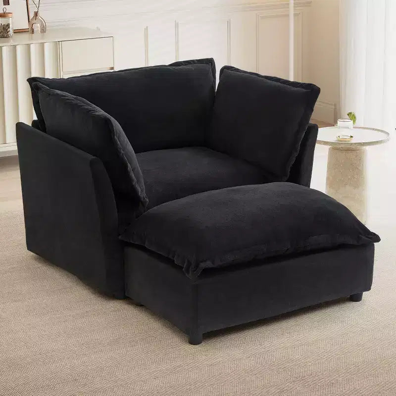 Fauteuil en tissu chenille avec pouf mobile, assise large et accoudoirs incurvés